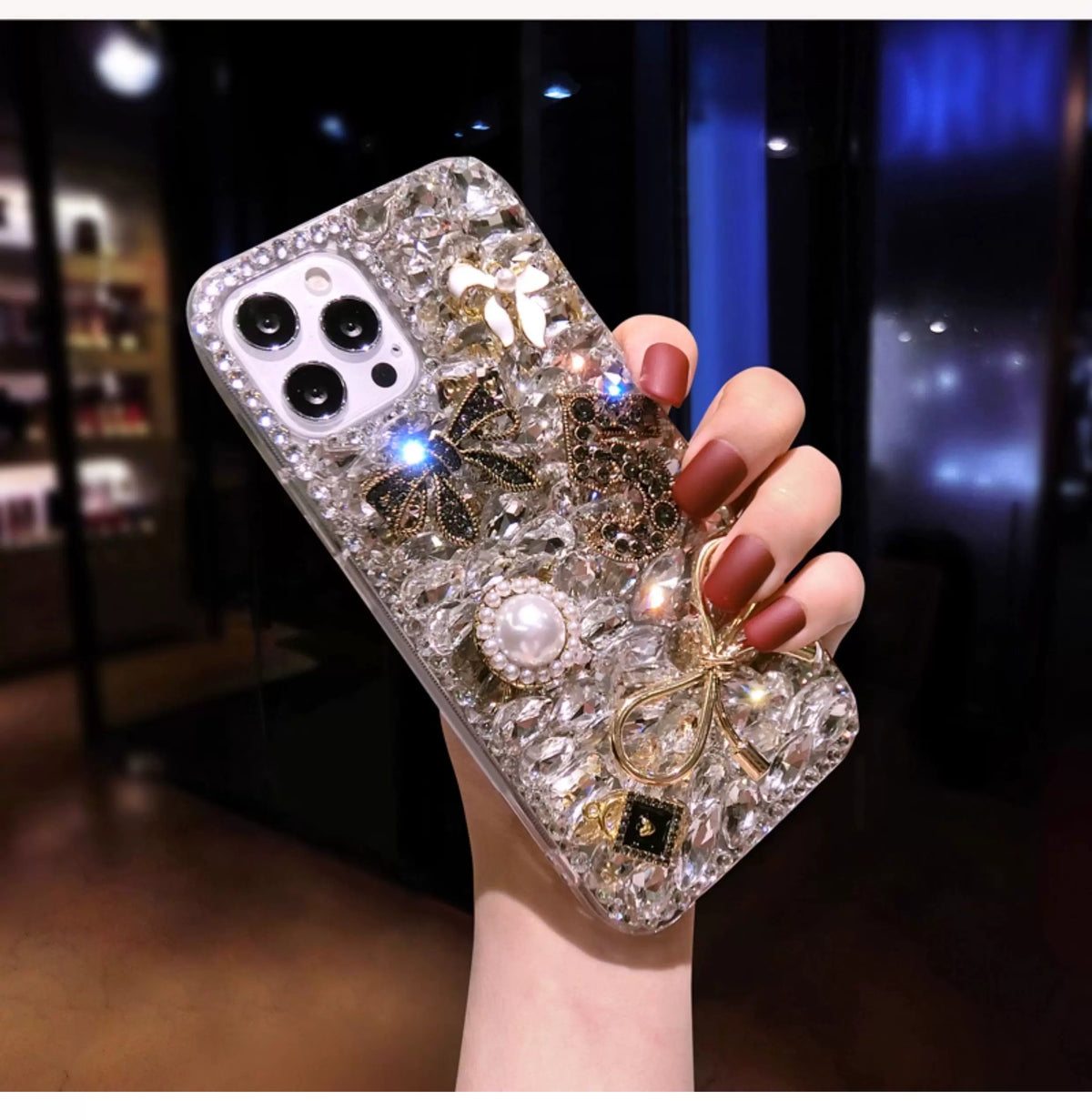 Luxury Crystal Charm iPhone Case with Gold Bows & Pearl Accents - close-up detail