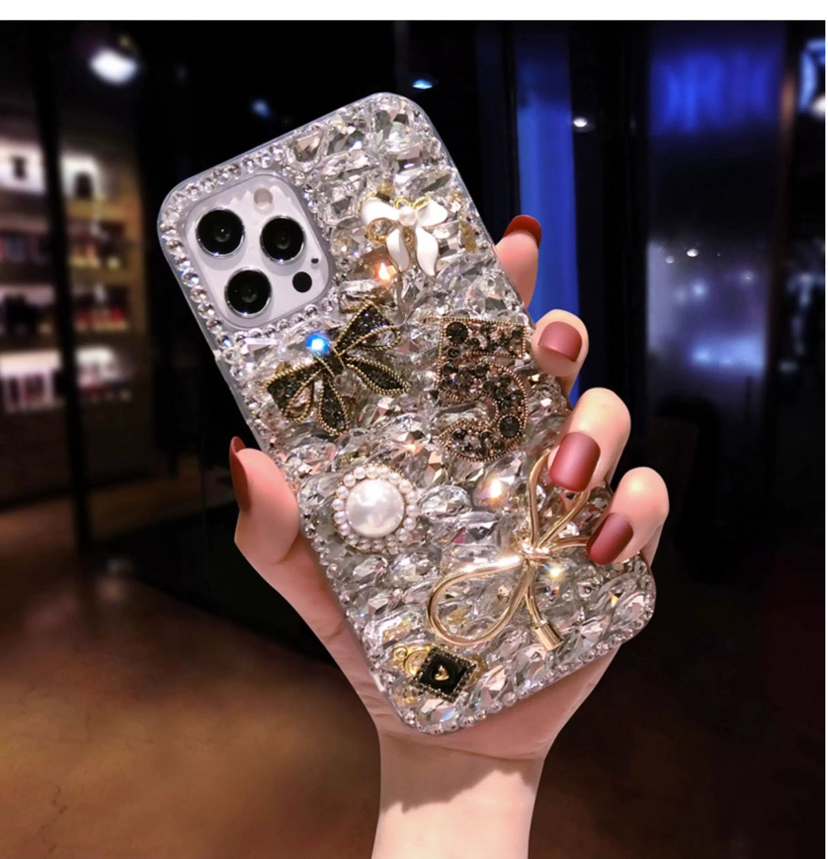 Luxury Crystal Charm iPhone Case with Gold Bows & Pearl Accents - side angle